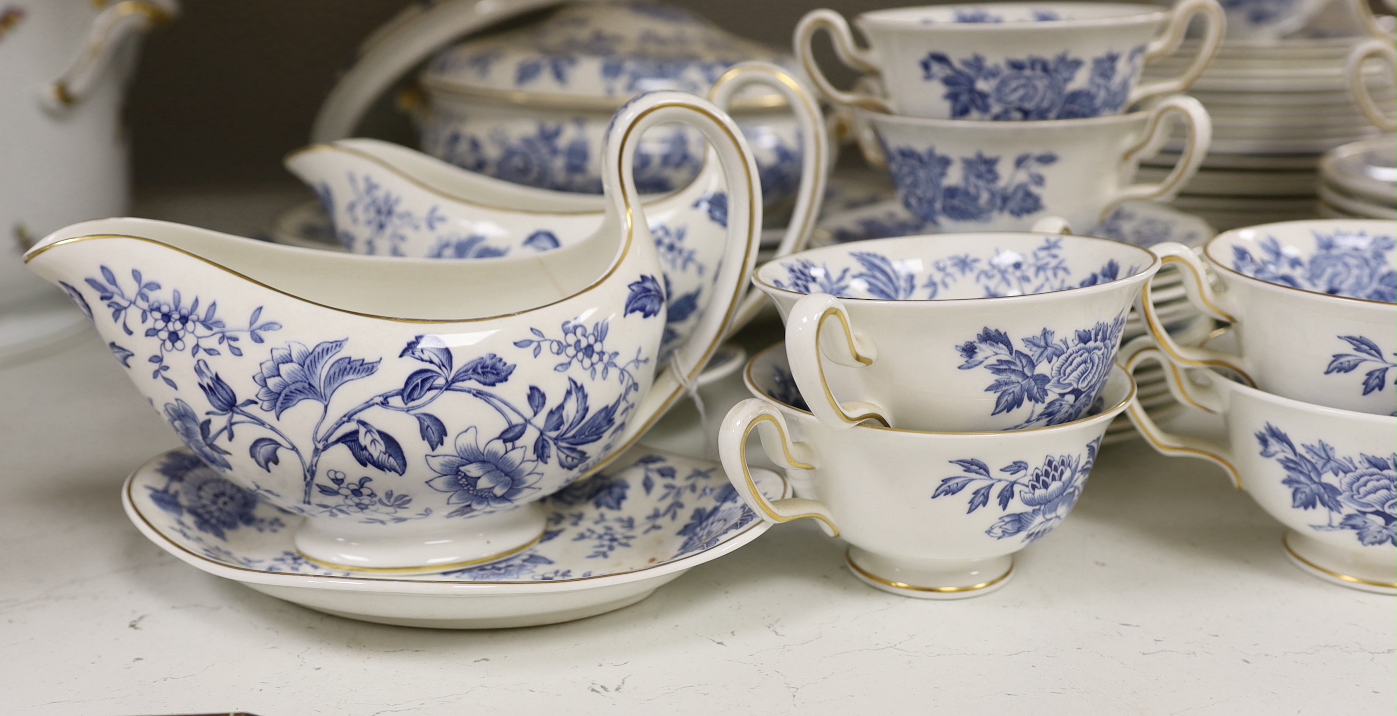 A Wedgwood bone china blue and white dinner service including oval platters, sauce boats and a tureen